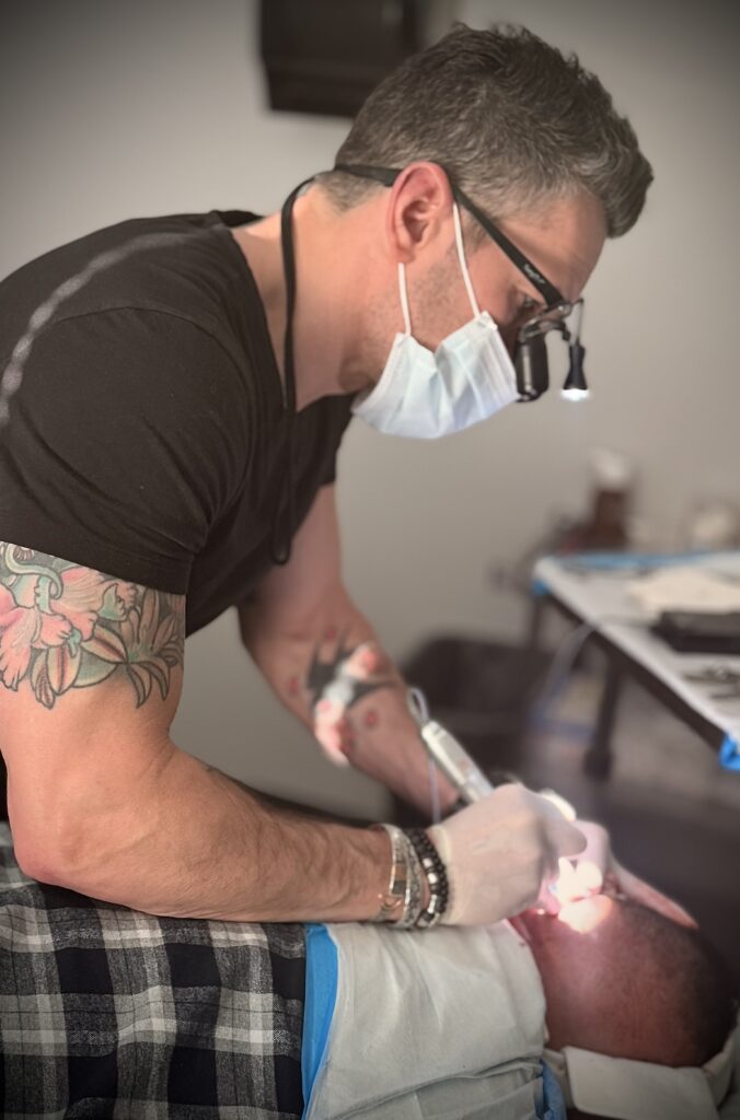 Dr. Matthew Lopresti performing hair transplant surgery near Boston